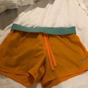 Orange and turquoise Nike Shorts